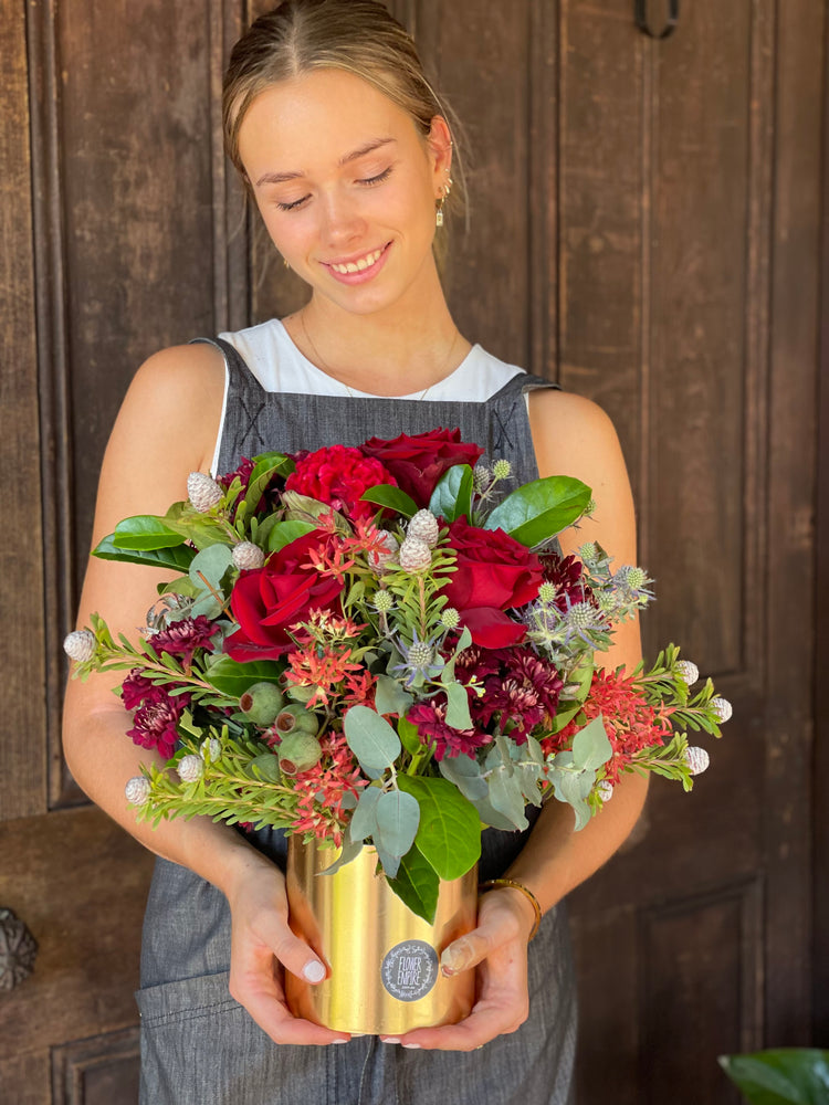 Christmas Arrangement In A Gold Pot